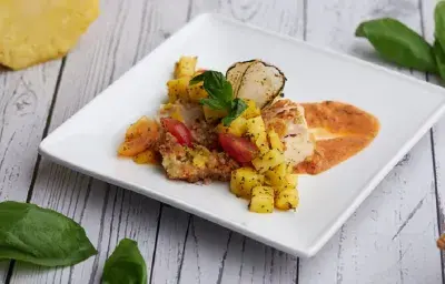 Cinnamon Toast Crusted Chicken with A Spicy Tomato Coconut Sauce and Pineapple Salsa